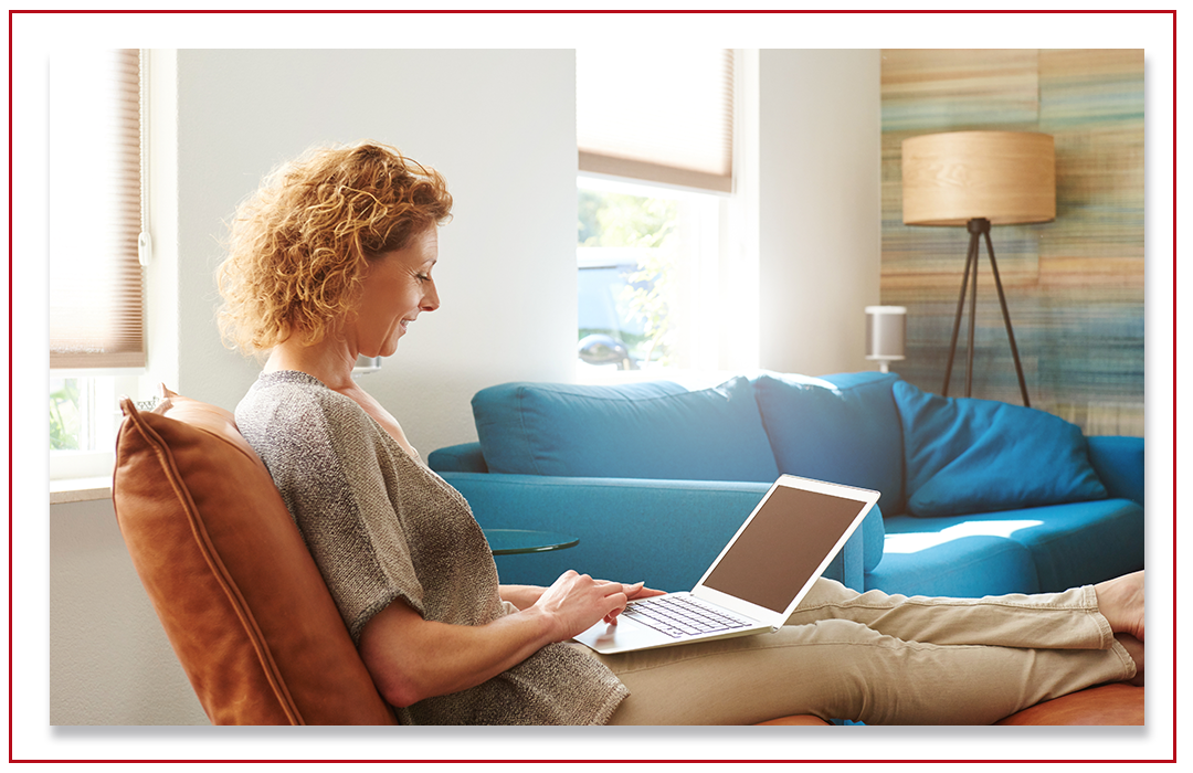 woman using a laptop to sign up for membership