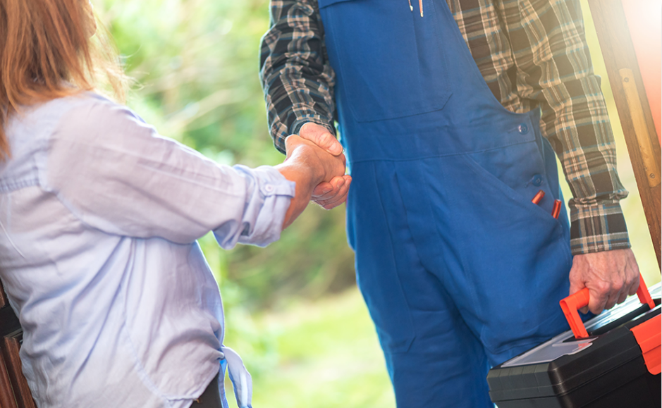 HVAC technician shaking clients hand after completing a job