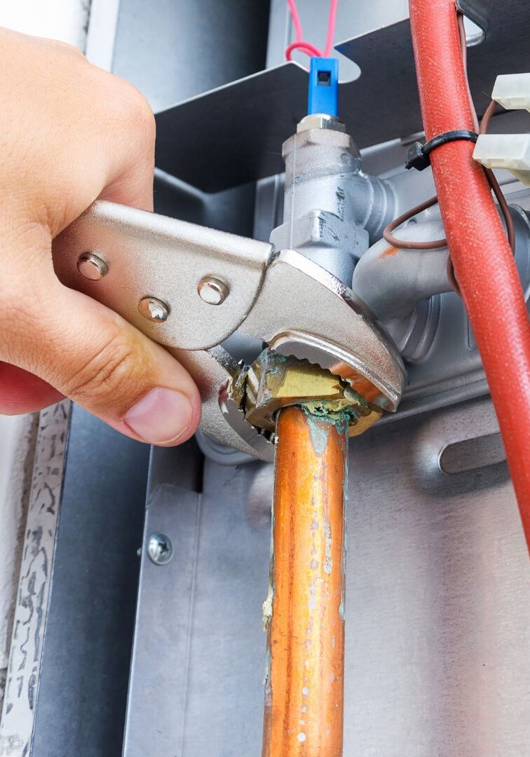 An HVAC expert working on a furnace