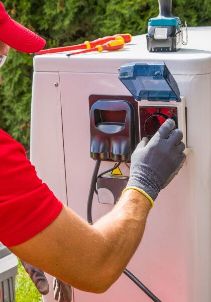 an HVAC technician working on an ac unit